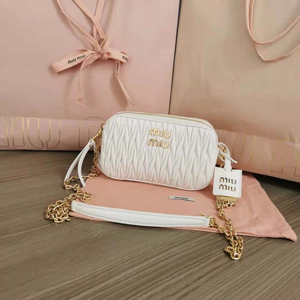 Close-up of white matelassé quilting detail on Miu Miu mini-bag