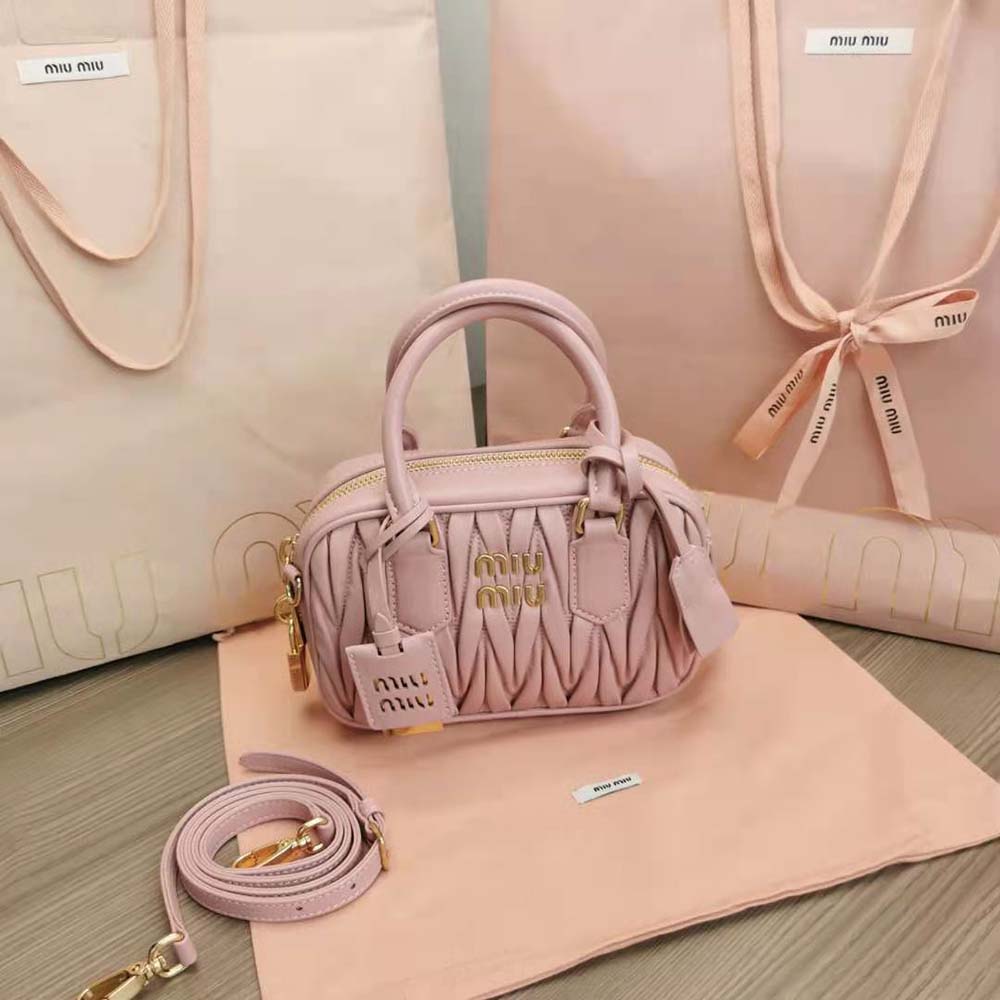 Close-up of pink matelassé quilting on Miu Miu top-handle bag
