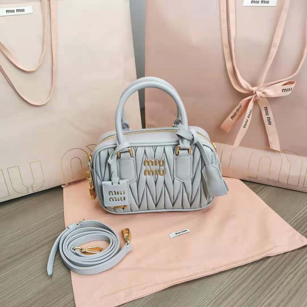 Close-up of matelassé stitching and silver hardware on Miu Miu bag