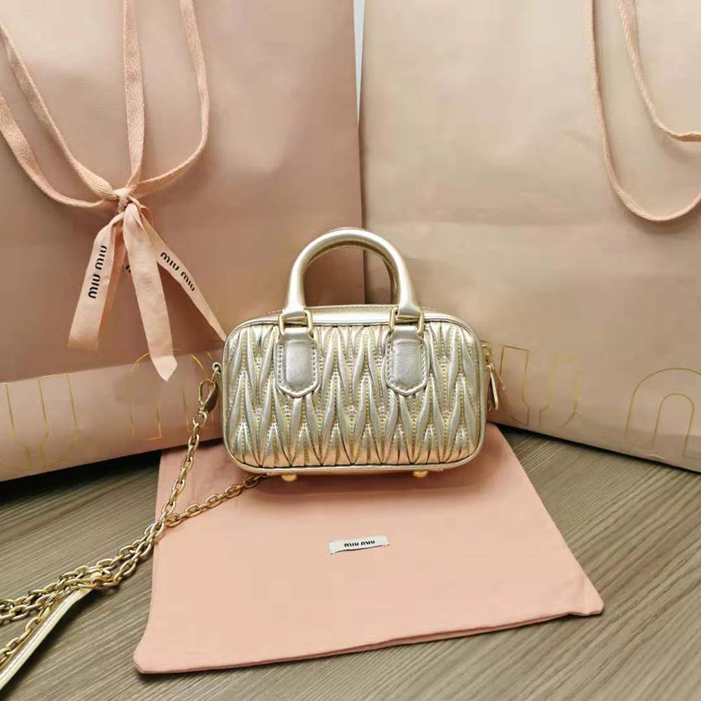 Side angle showing compact silhouette of Miu Miu Women Matelassé Nappa Leather Mini-Bag