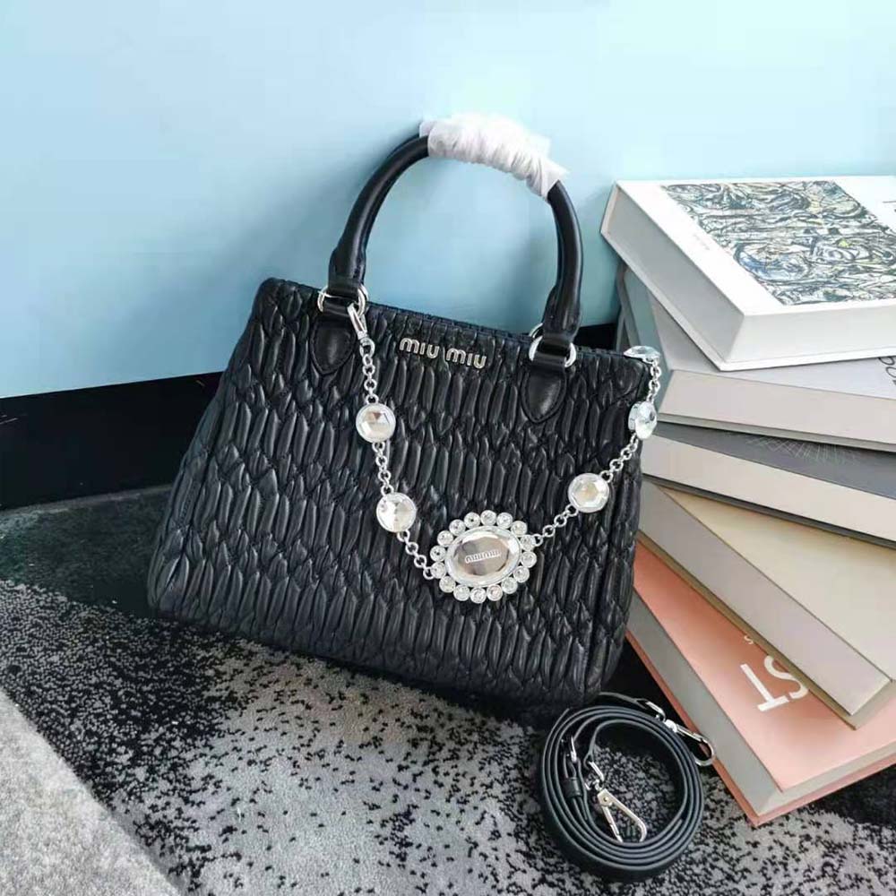 Close-up of crystal hardware on Miu Miu Women Miu Crystal Cloqué Nappa Leather Handbag-Black