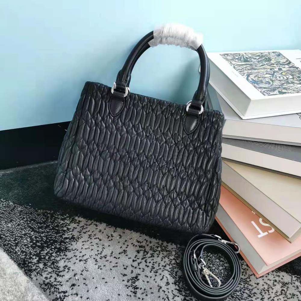 Side angle showing textured cloqué nappa leather on Miu Miu Women Miu Crystal Cloqué Nappa Leather Handbag-Black