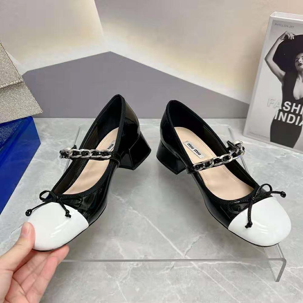 Top angle showing silhouette of Miu Miu Women Naplak Pumps black