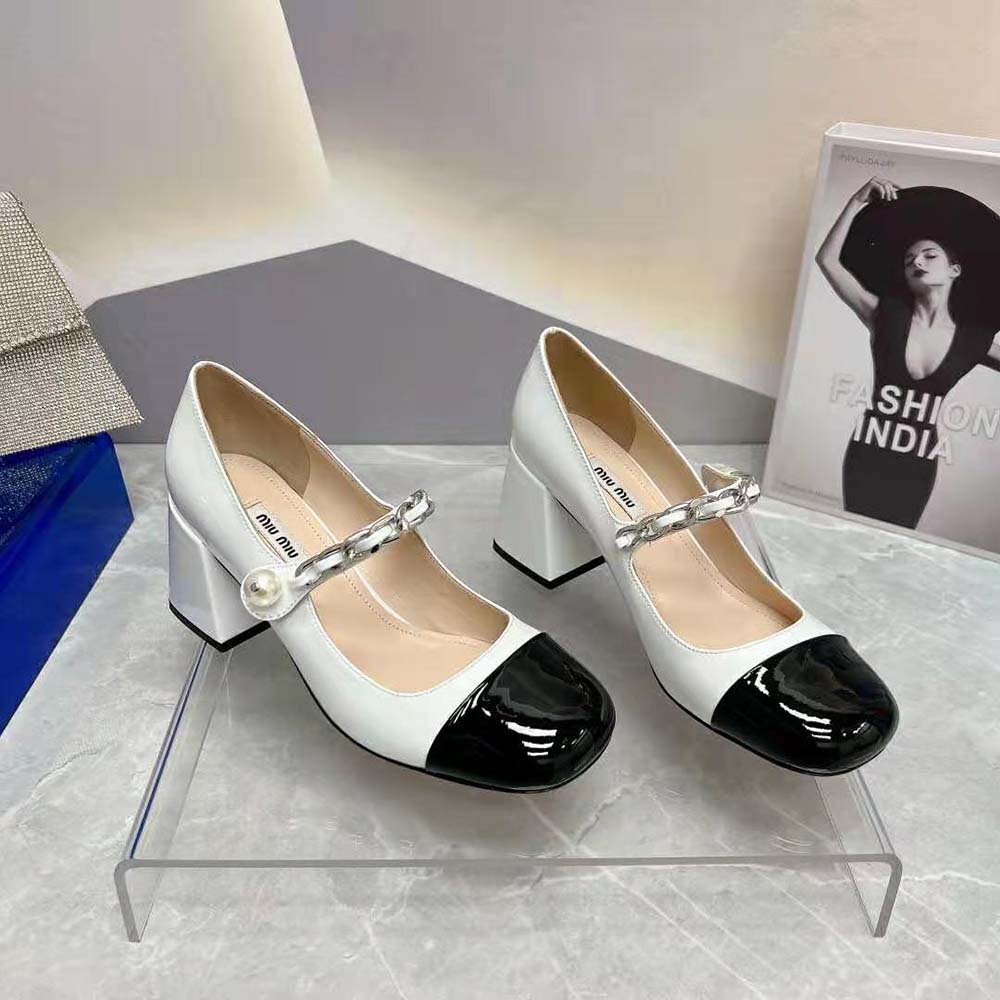 Close-up of signature logo plaque on Miu Miu Women Patent Leather Pumps
