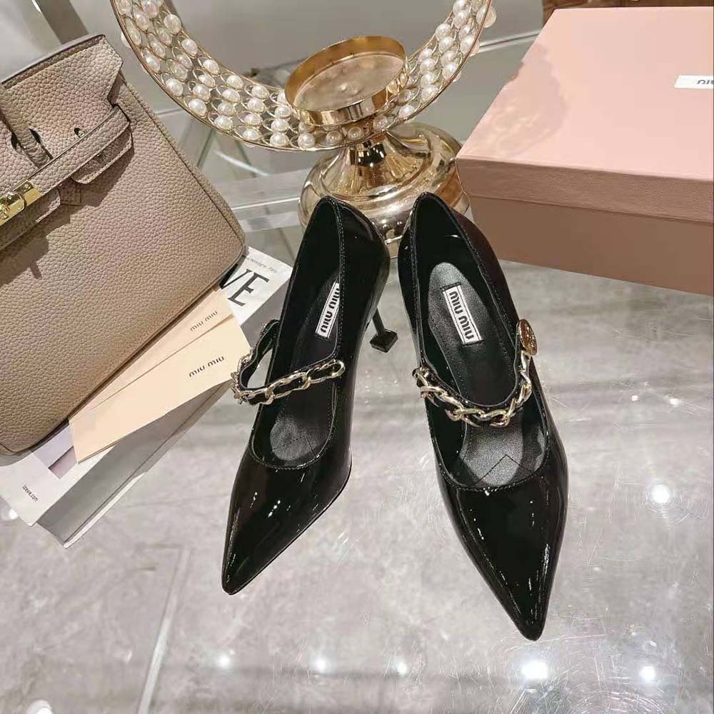Close-up of glossy patent leather and heel detail on Miu Miu pumps