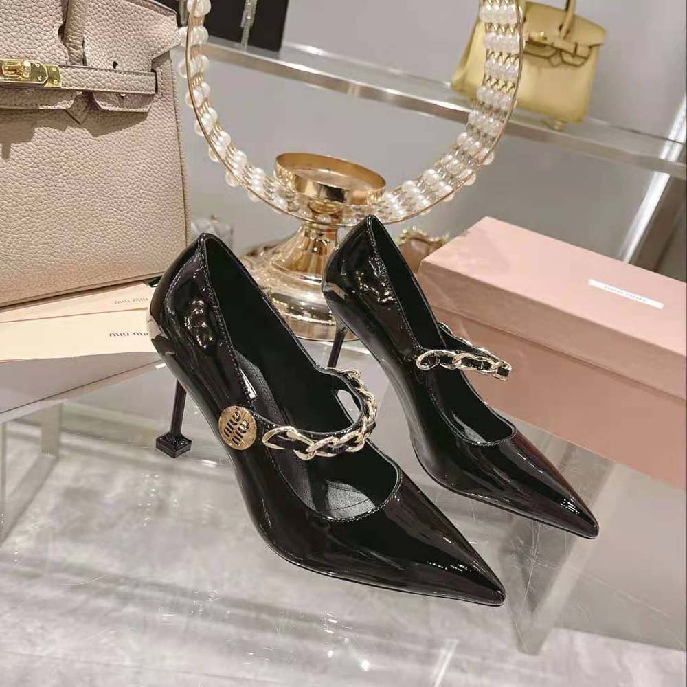 Top view showing pointed toe and sleek silhouette of Miu Miu black pumps