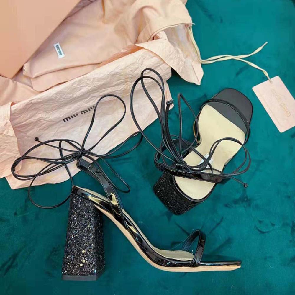 Rear angle showing buckle and heel of Miu Miu Women Patent Leather and Glitter Sandals