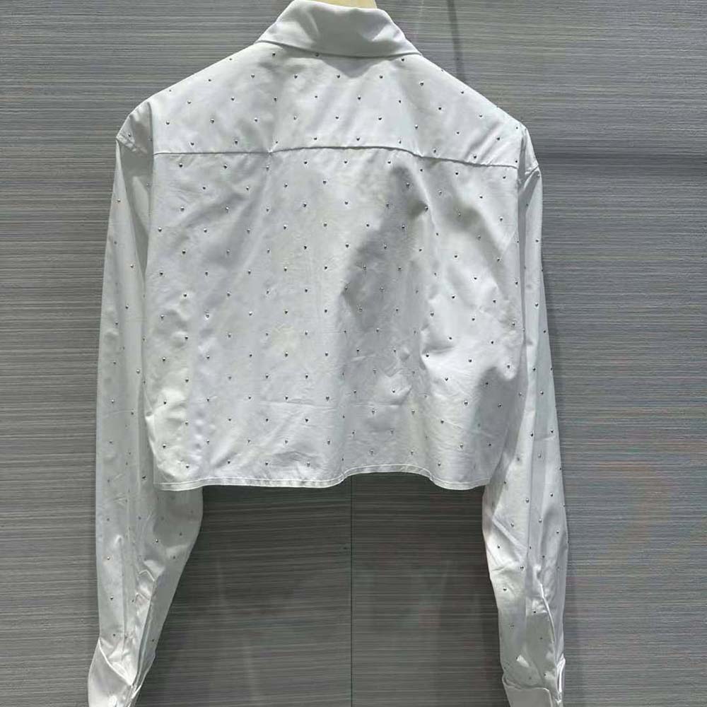 Side angle showing button closure and fit of Miu Miu Women Poplin Shirt