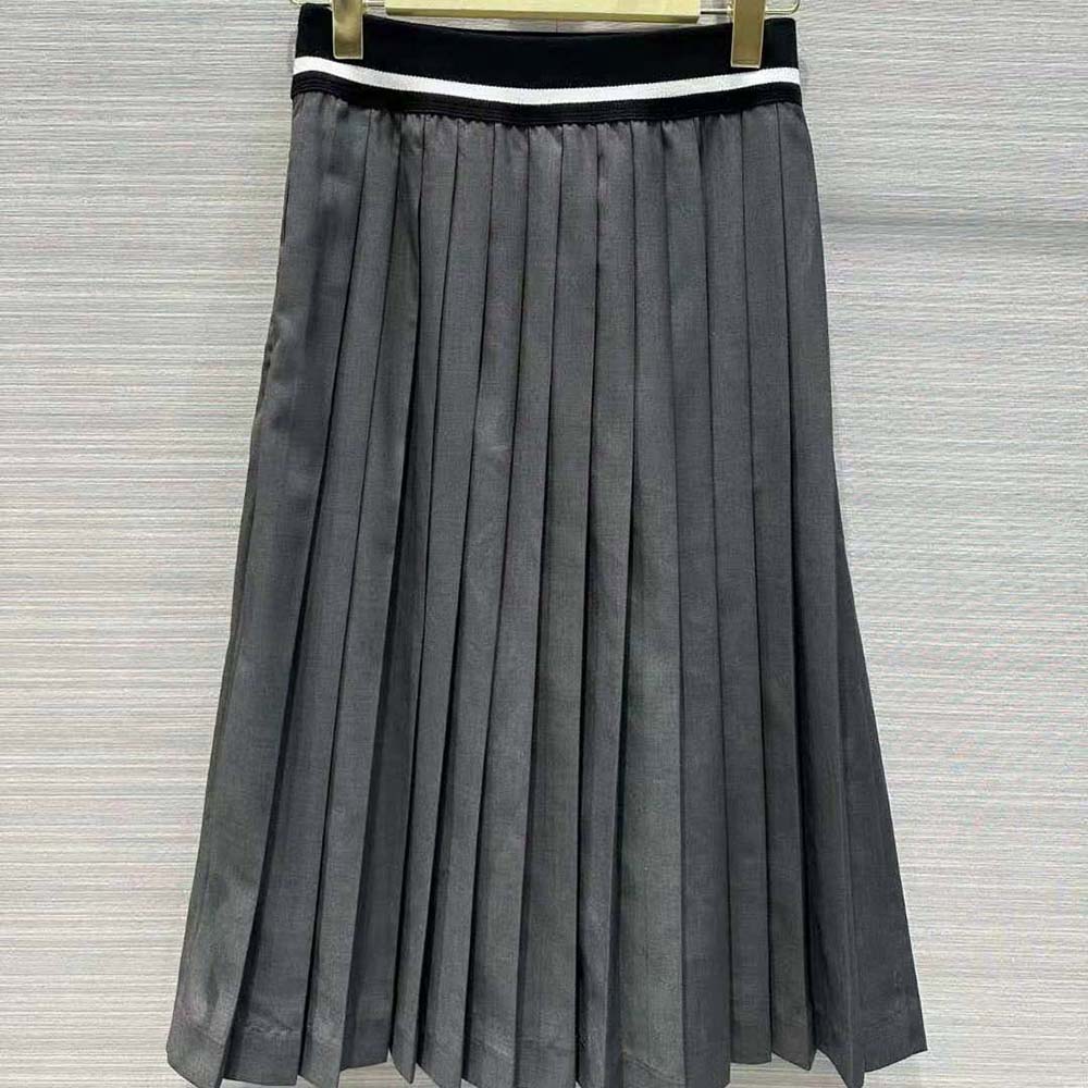 Side angle showcasing A-line silhouette of Miu Miu Women Prince of Wales Check Skirt with Intarsia Logo Knit Waistband