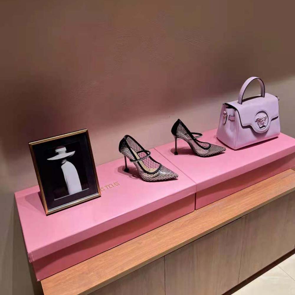 Close-up detail of vinyl and mesh texture on Miu Miu pumps