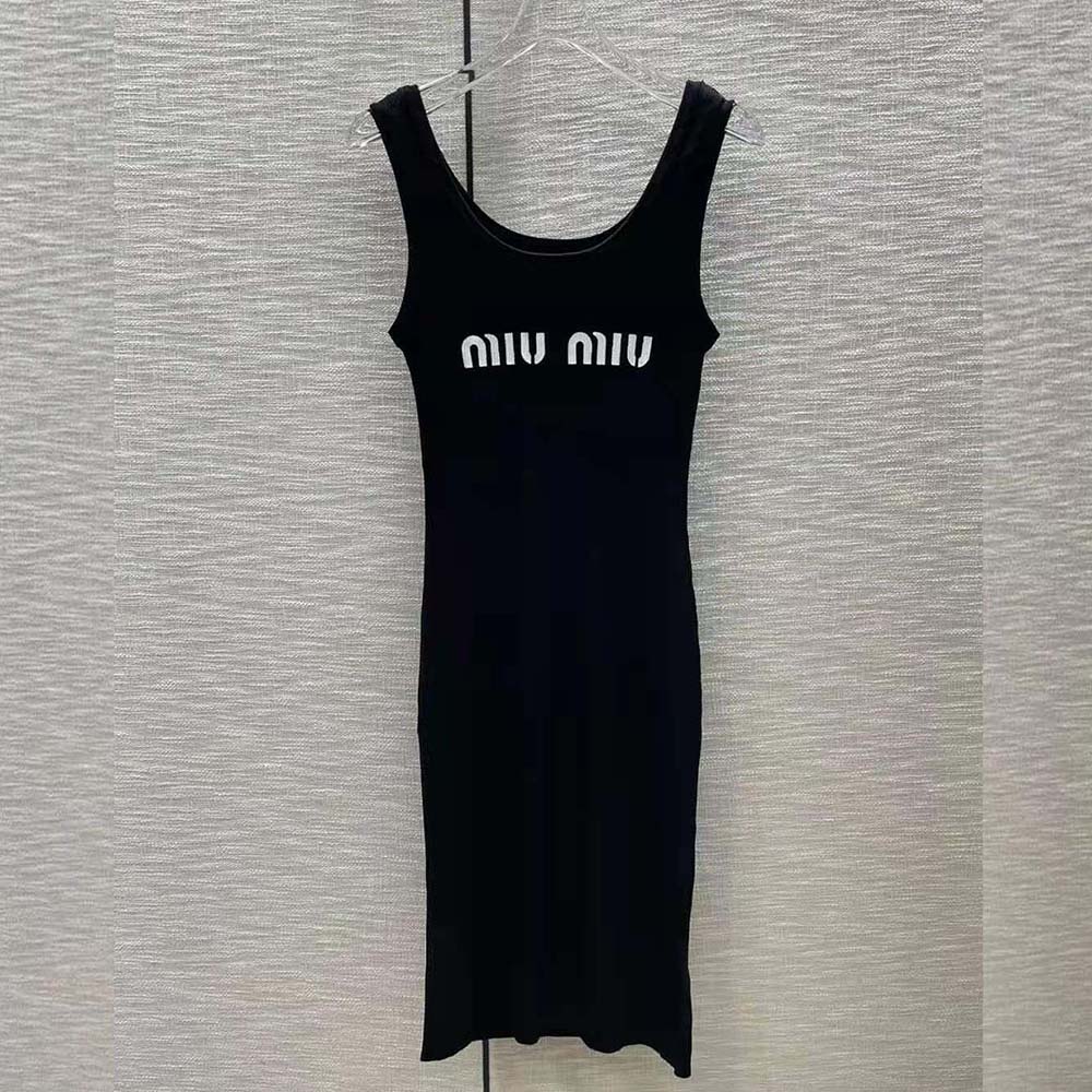 Close-up of intarsia logo detailing on black Miu Miu dress