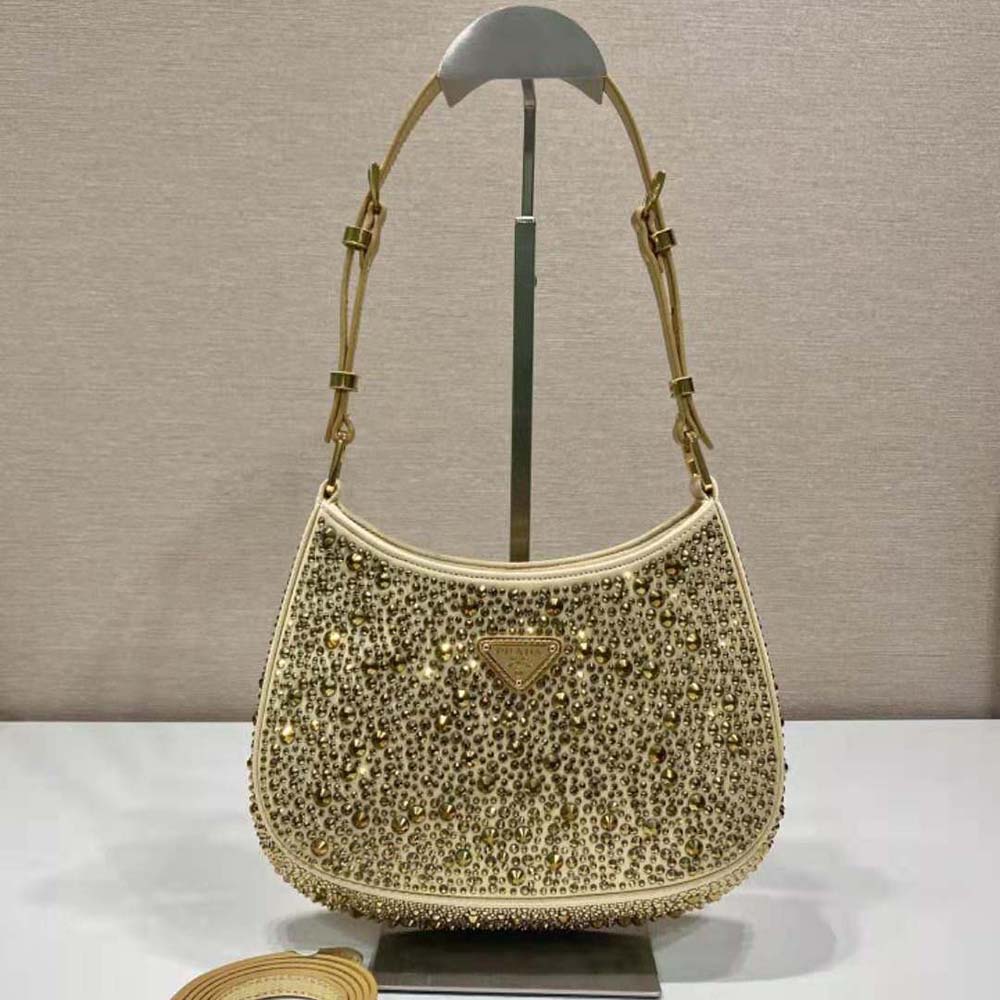 Close-up of gold-tone hardware and crystal detailing on Prada Women Cleo Satin Bag