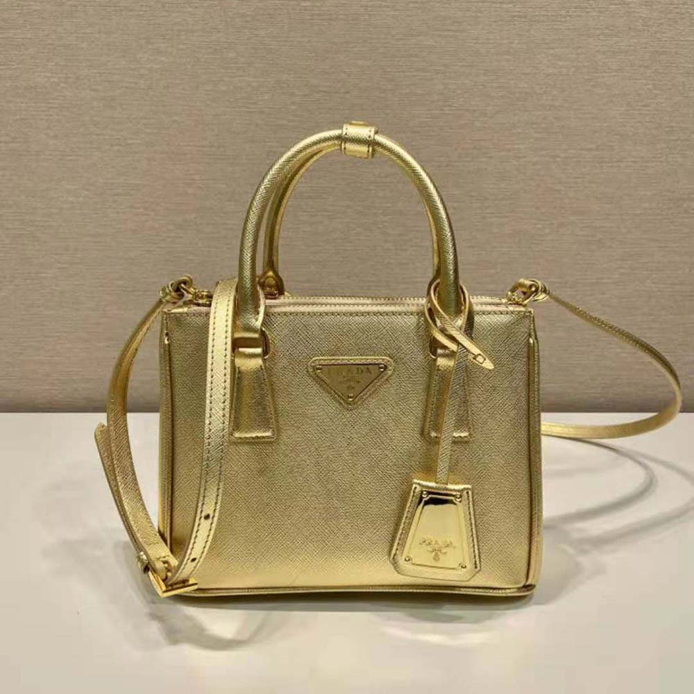 Close-up of gold hardware and signature logo on Prada mini-bag