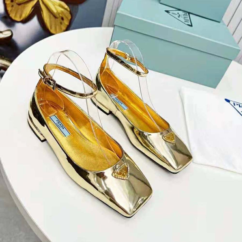 Close-up of gold metallic leather texture on Prada Women Metallic Leather Ballerinas-Gold
