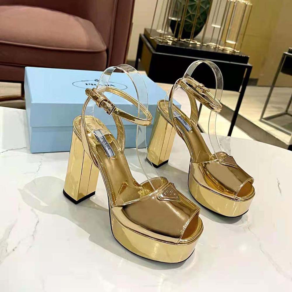 Close-up of gold-tone buckle on Prada Women Metallic Leather Platform Sandals