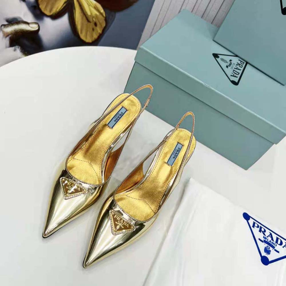 Close-up of gold buckle and Prada logo on slingback pumps