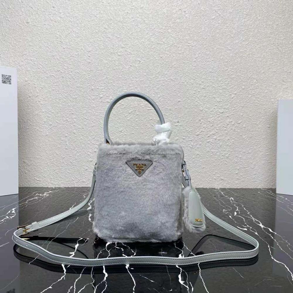 Close-up of silver hardware and Prada logo on Panier Shearling Mini-Bag