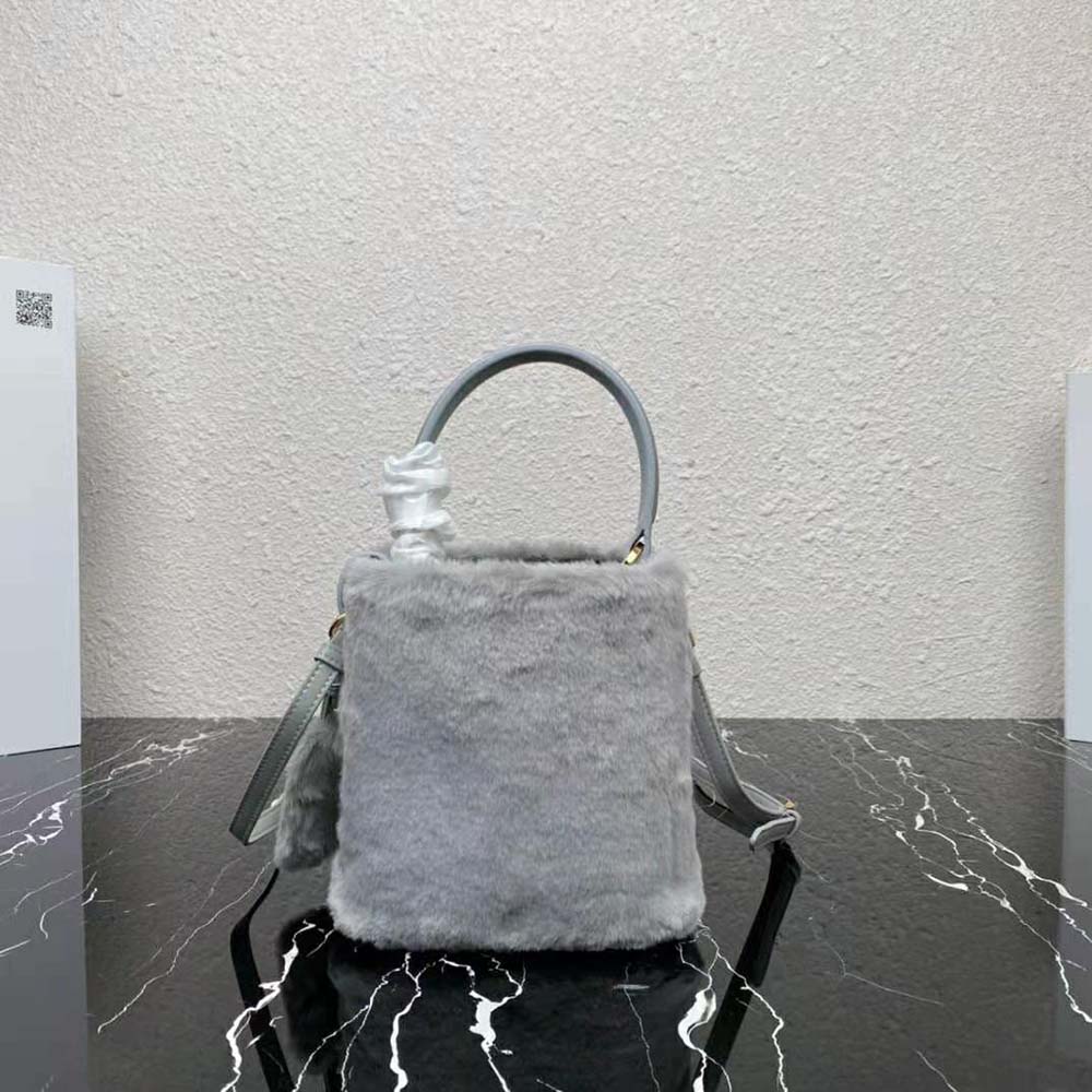 Side angle showing compact silhouette of Prada Women Panier Shearling Mini-Bag-Silver