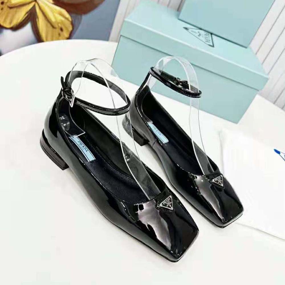 Side angle showing glossy finish of Prada Women Patent Leather Ballerinas-Black