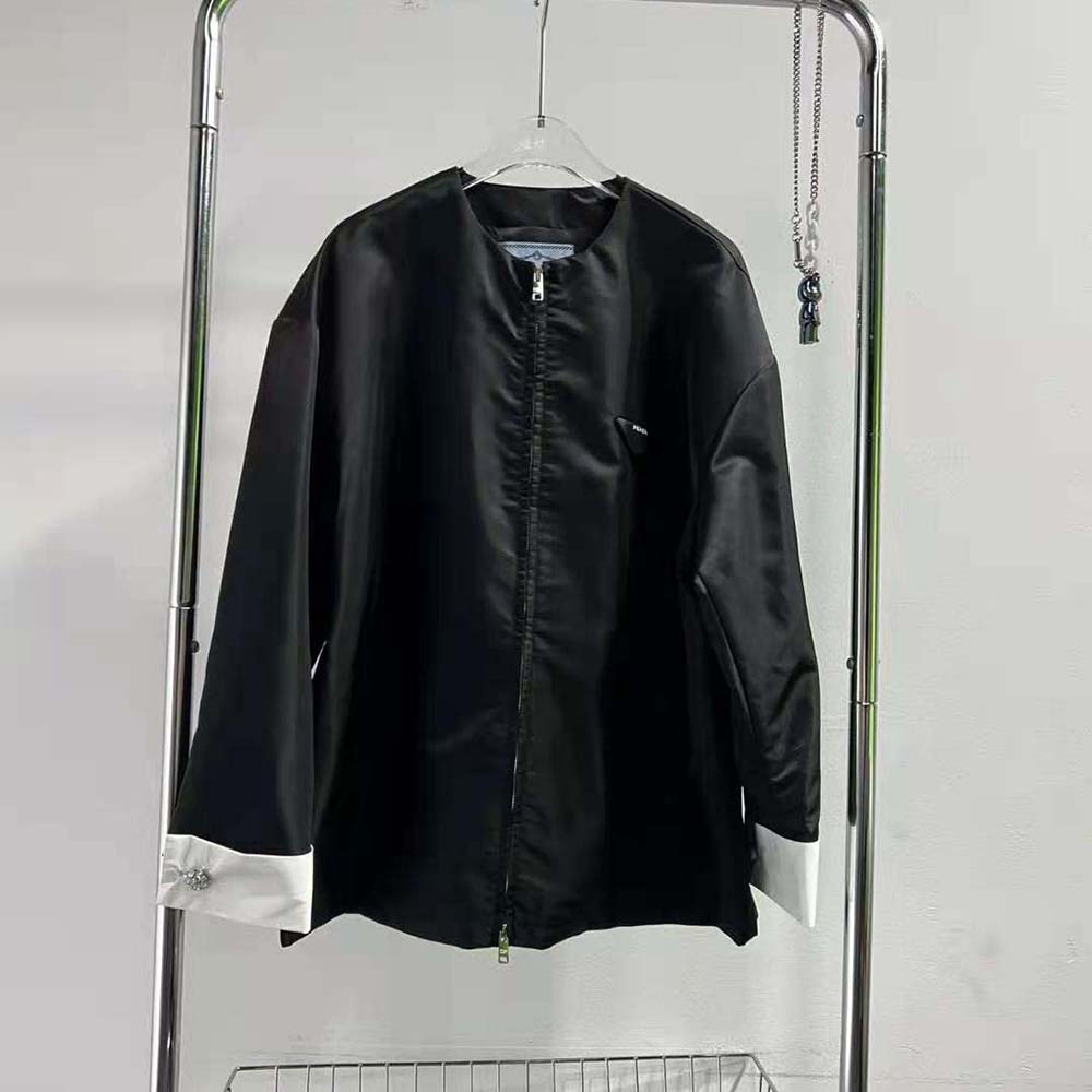 Close-up of silver hardware and detachable cuffs on Prada Women Re-Nylon Blouson Jacket