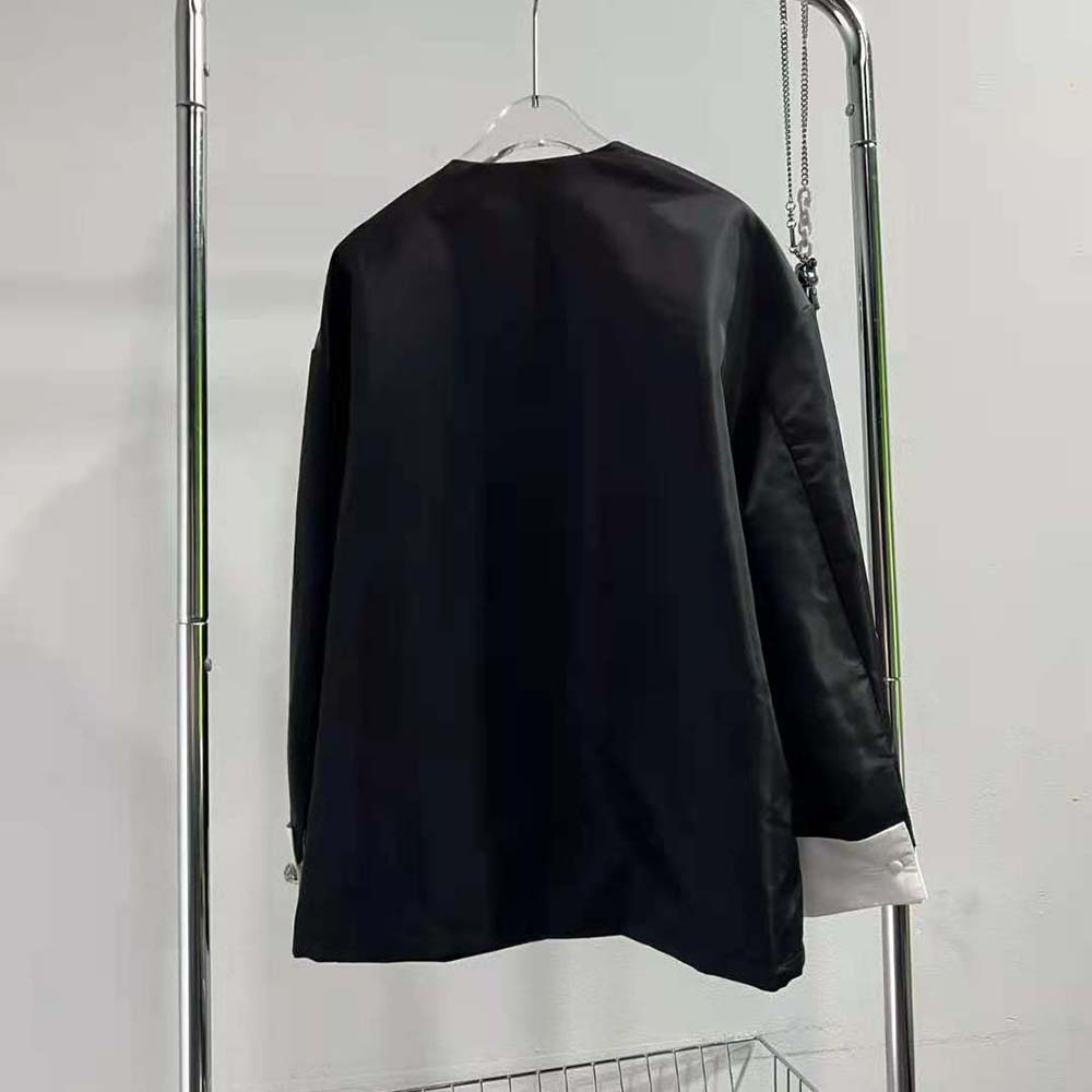 Side profile highlighting silhouette and fabric texture of Prada Women Re-Nylon Blouson Jacket
