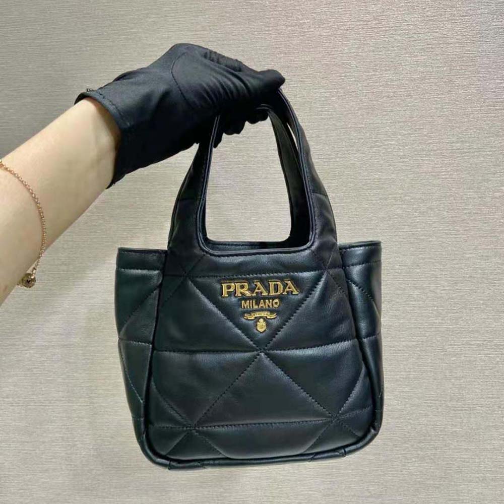 Close-up of black nappa leather and topstitching on Prada tote