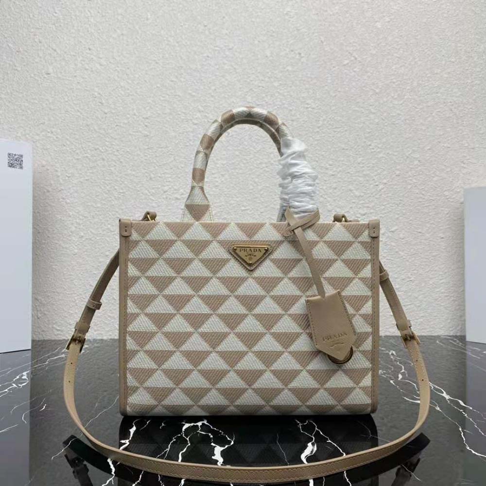 Close-up of embroidered logo on Prada Small Symbole Handbag beige fabric