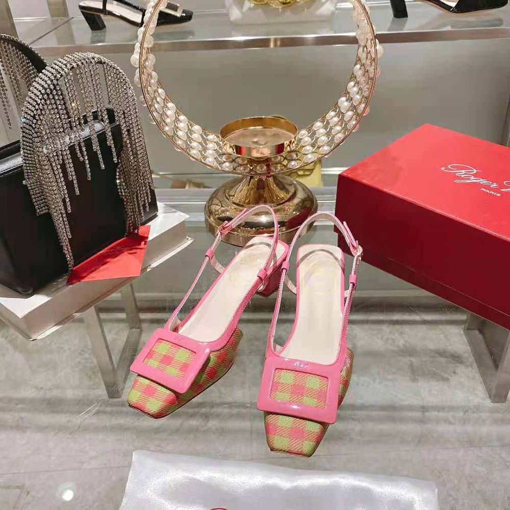 Close-up of glossy patent buckle on Roger Vivier Belle Vivier Slingback Pumps