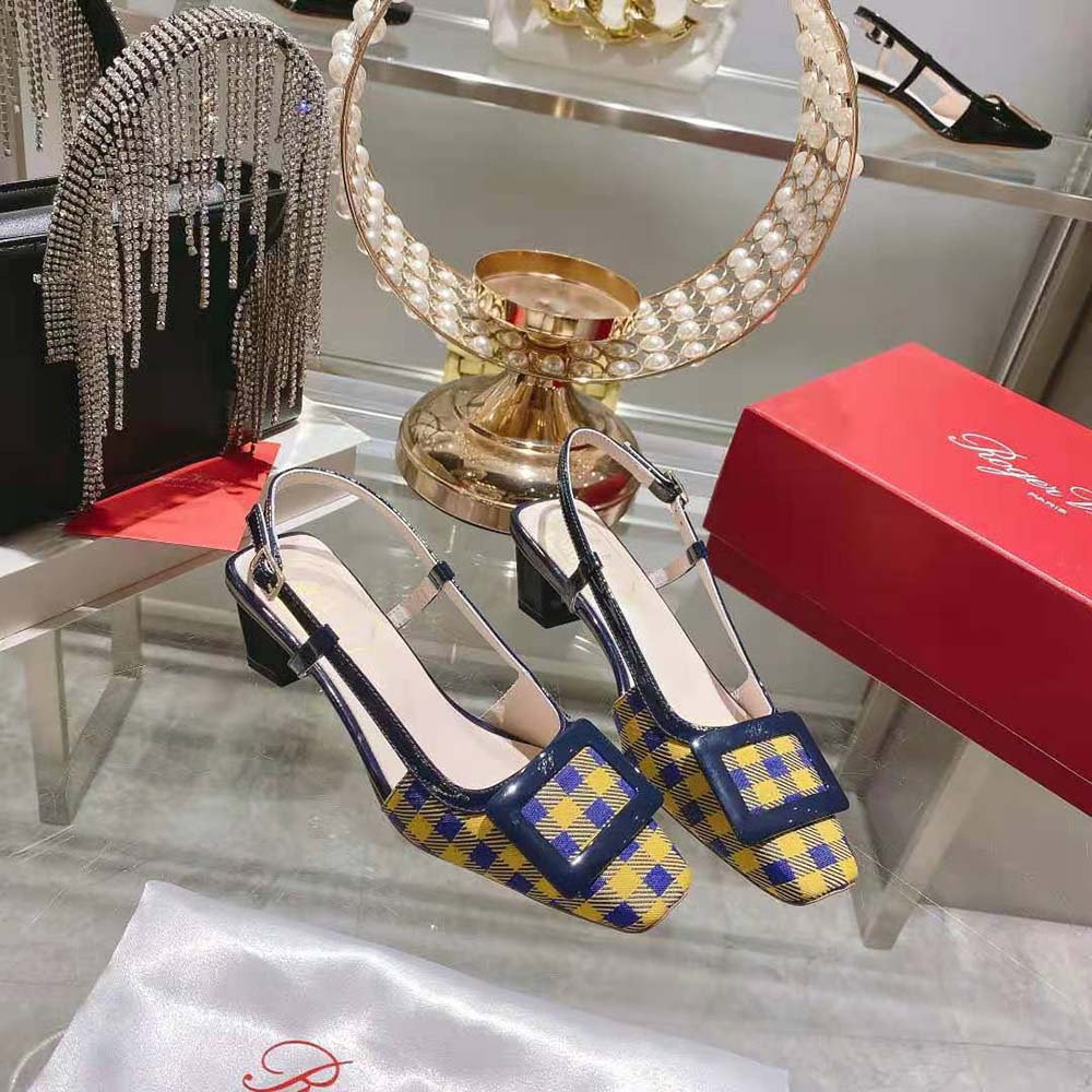 Rear angle showing adjustable slingback strap of Roger Vivier Belle Vivier yellow pumps