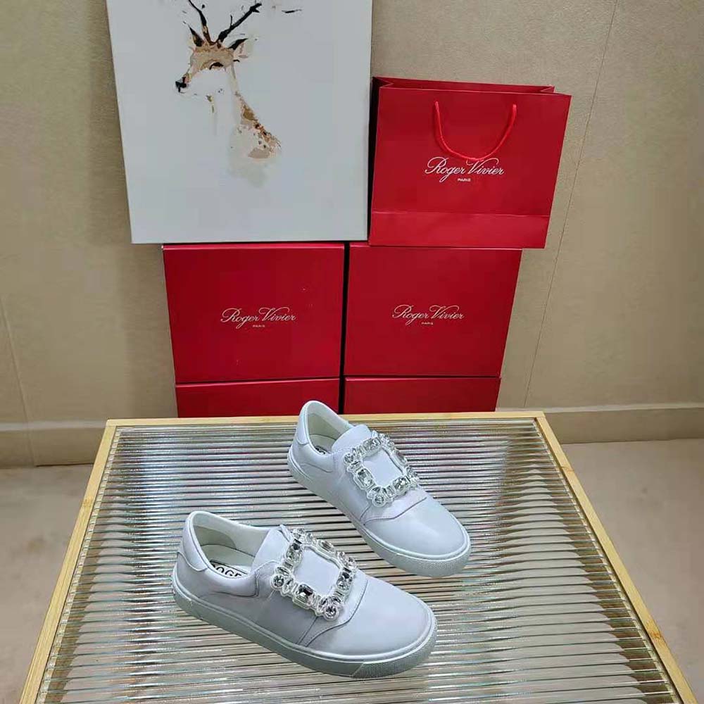 Overhead shot showing white leather and silver hardware of Roger Vivier Sneakers