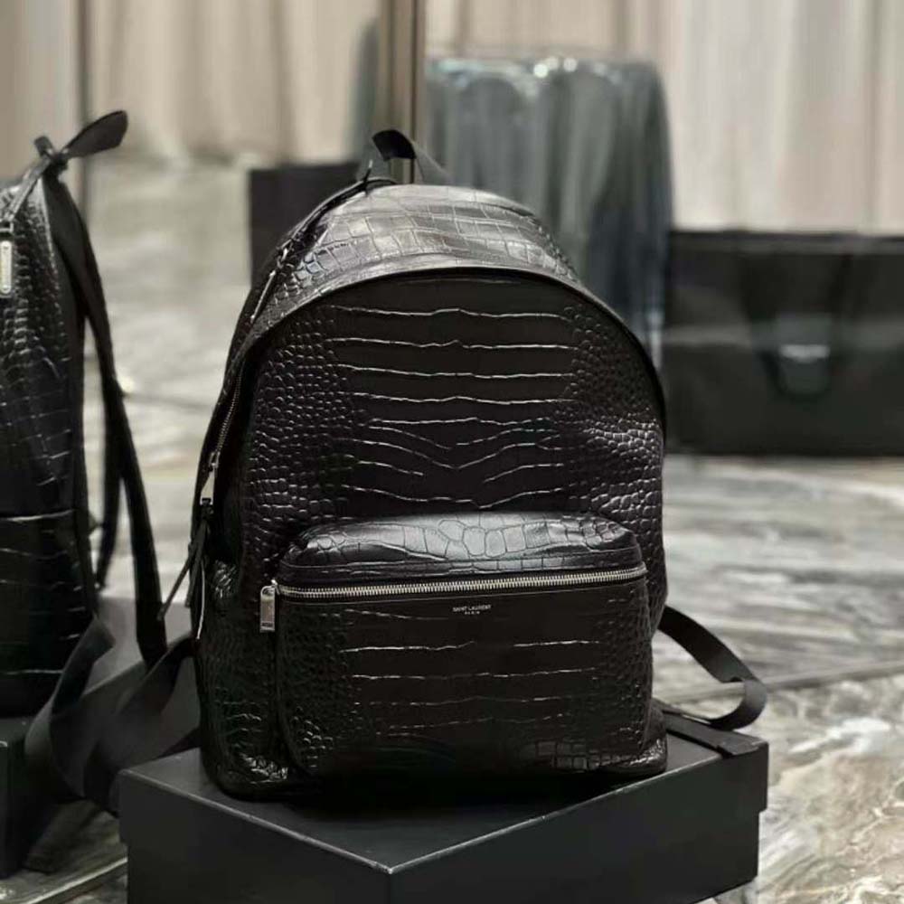 Side angle showing adjustable straps on Saint Laurent City Backpack