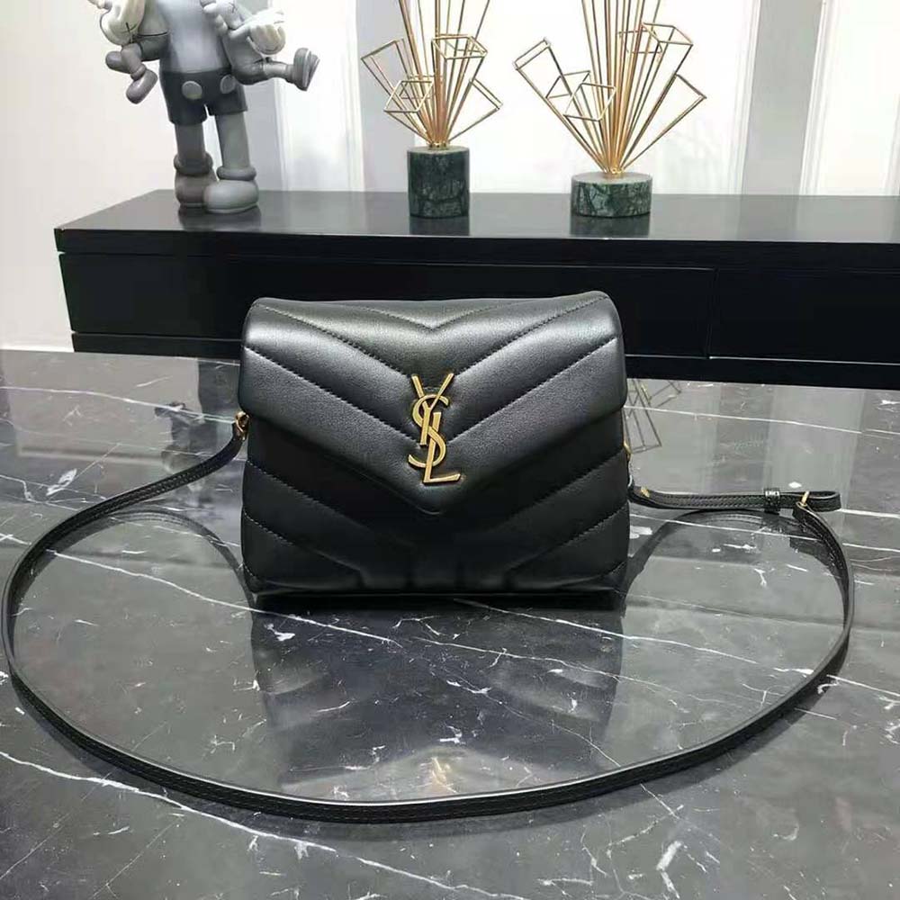 Close-up on gold Y clasp detail of Saint Laurent YSL Women Loulou Toy Strap Bag