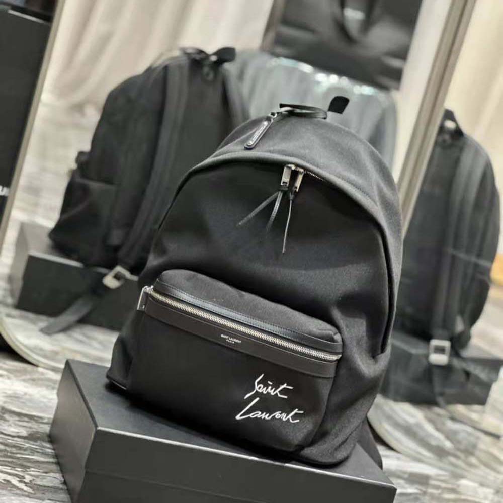 Side profile showing adjustable straps on Saint Laurent embroidered city backpack