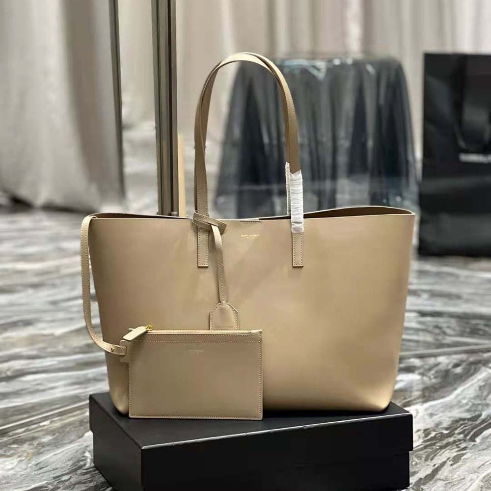 Side angle showing zipper closure and strap of Saint Laurent YSL Women Shopping Saint Laurent E/W