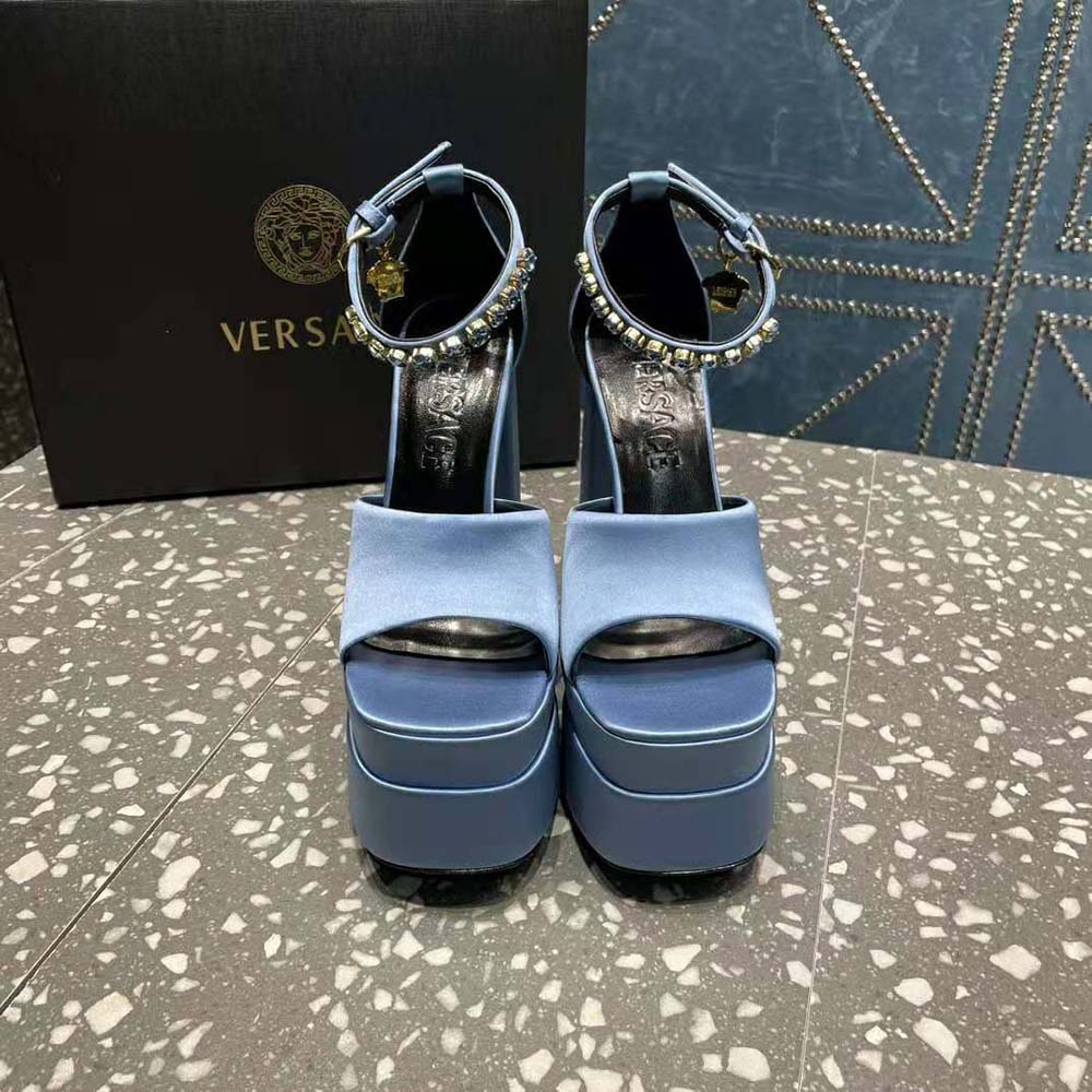 Close-up of gold Medusa emblem on Versace Women Medusa Aevitas Platform Sandals-Blue