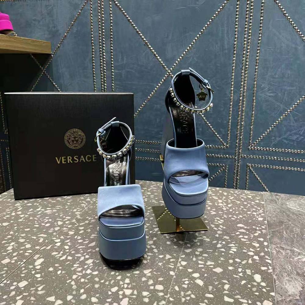 Top angle showcasing blue leather and buckle on Versace Women Medusa Aevitas Platform Sandals-Blue