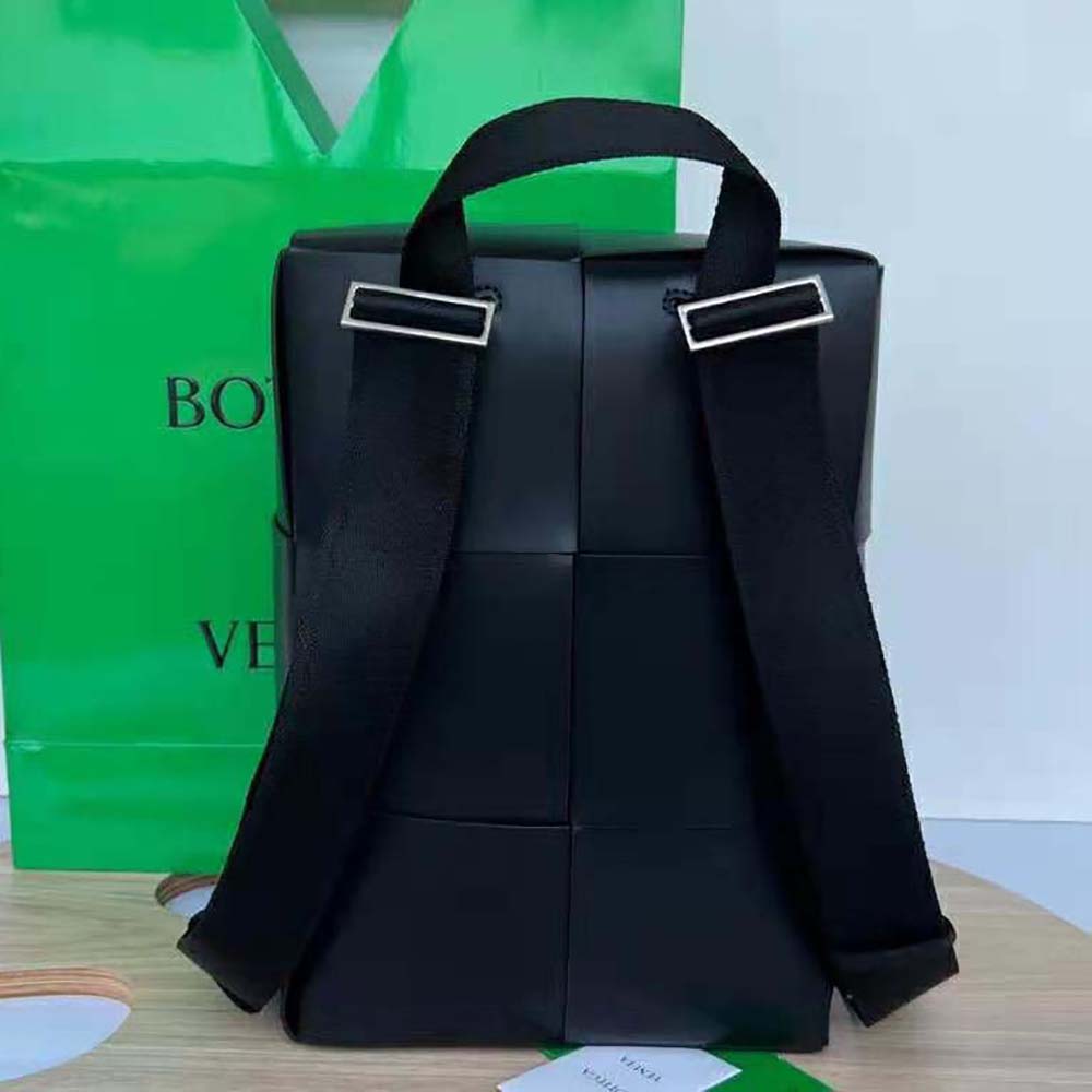 Side angle showing brushed metal hardware on Bottega Veneta backpack