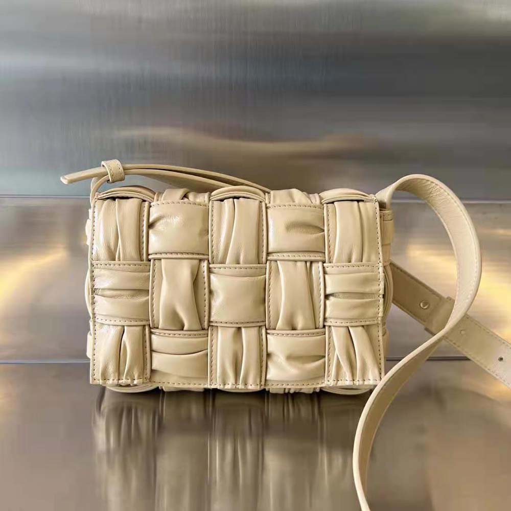 Close-up of woven intreccio leather detail on the Bottega Veneta cross-body bag