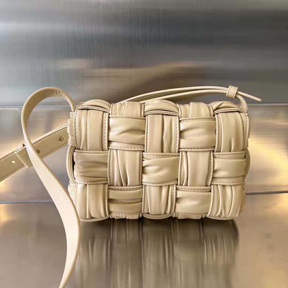 Side angle showing gold-tone hardware and flap closure on Bottega Veneta bag