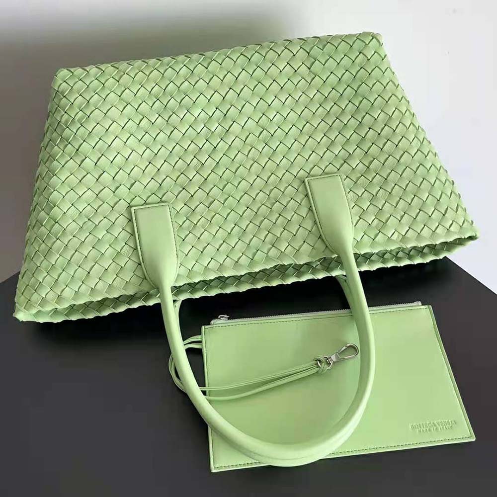 Side angle showcasing the detachable strap on Bottega Veneta Medium Cabat Leather Tote Bag