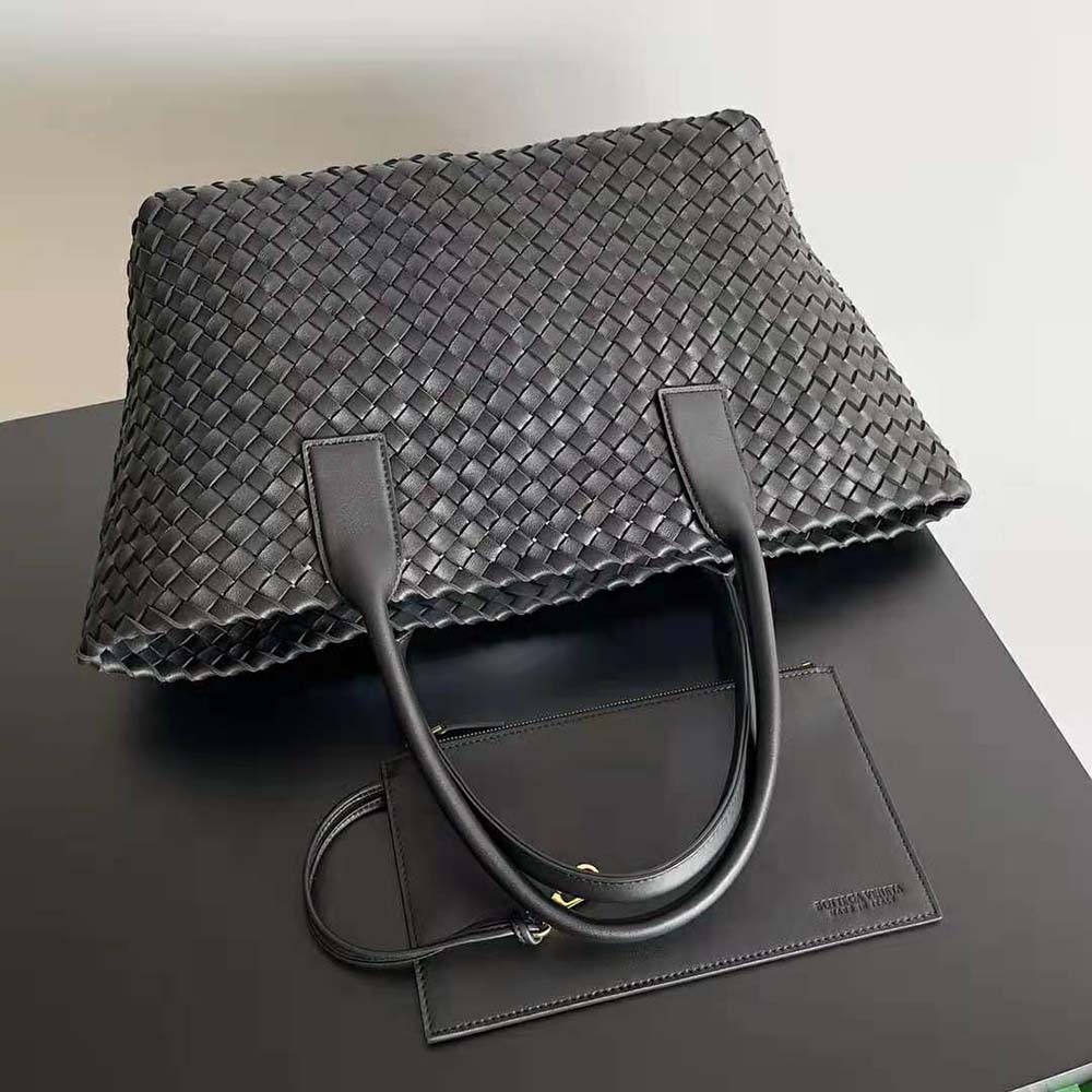 Side angle showing detachable strap and structured silhouette on tote bag
