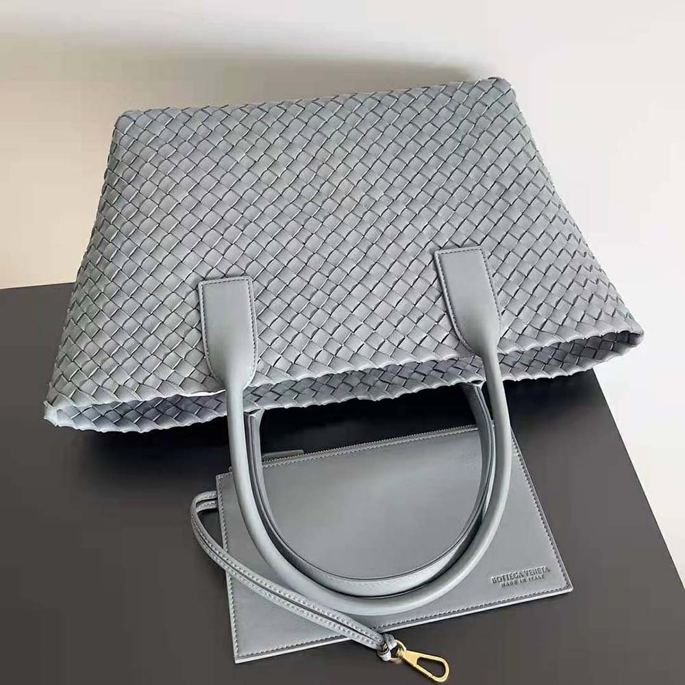 Side profile showing detachable strap and matte hardware of Bottega Veneta tote