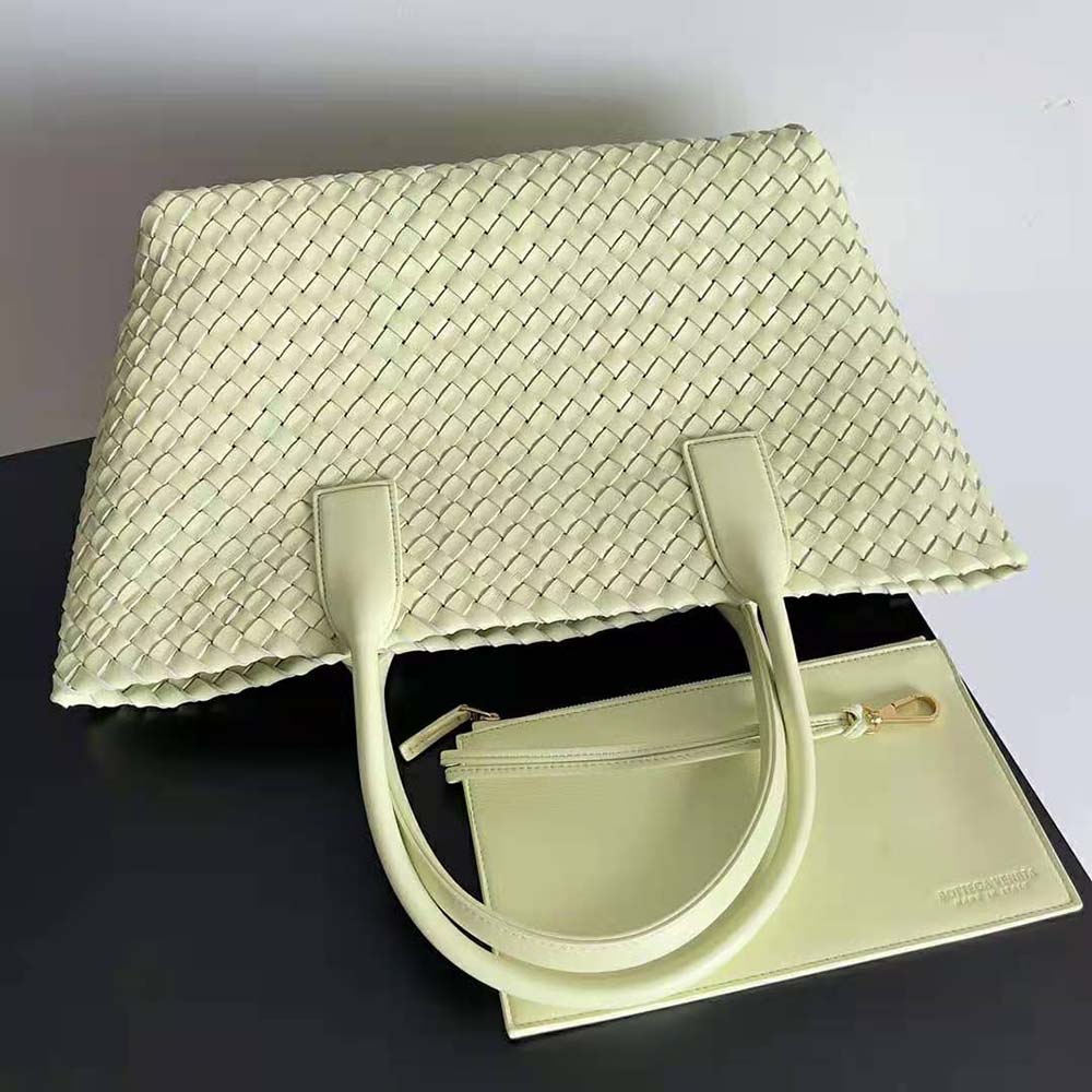 Side angle showing detachable strap on Bottega Veneta leather tote