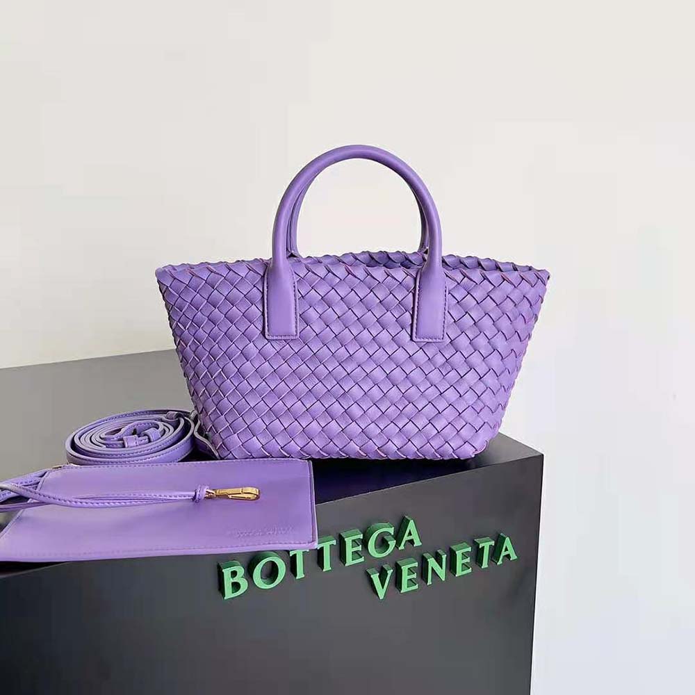 Close-up on signature intrecciato leather weave on purple tote bag