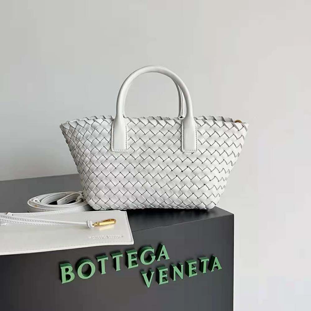 Close-up of intrecciato woven leather detail on Bottega Veneta Mini Cabat Tote in white
