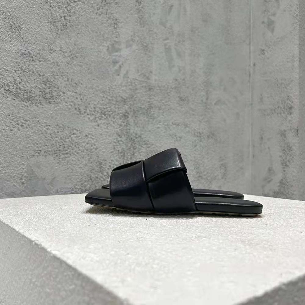 Close-up detail of black padded intreccio leather on Bottega Veneta flat mules
