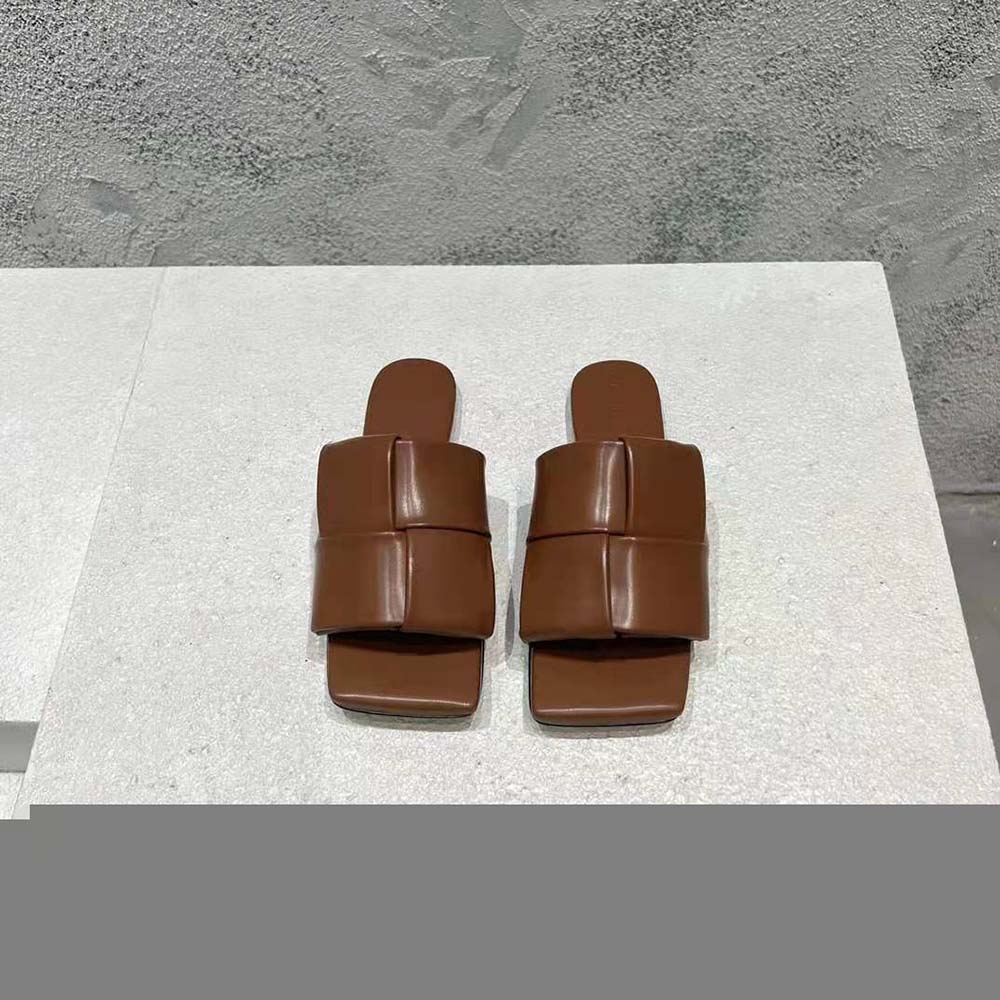 Close-up detail of intreccio leather weave on Bottega Veneta women’s flat mules