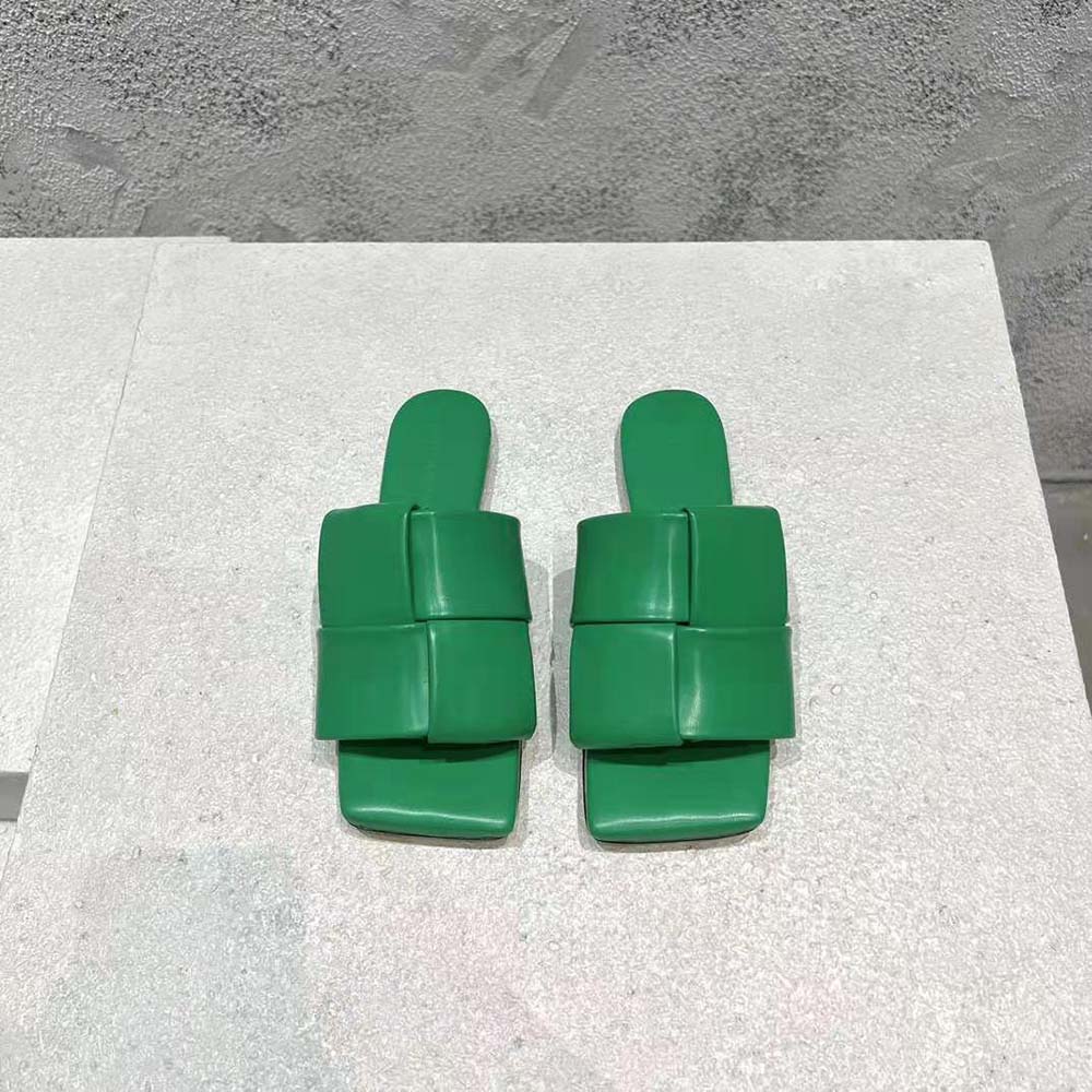 Overhead shot showing slip-on design of Bottega Veneta Women Patch Flat Mules in green