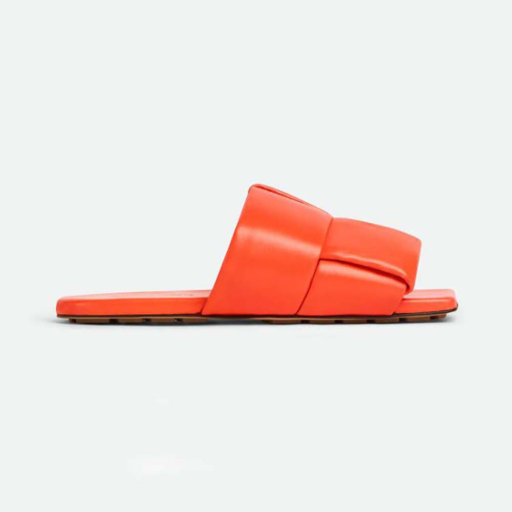 Side view of Bottega Veneta Women Patch Flat Mule Padded Intreccio Leather Flat Mules-Orange
