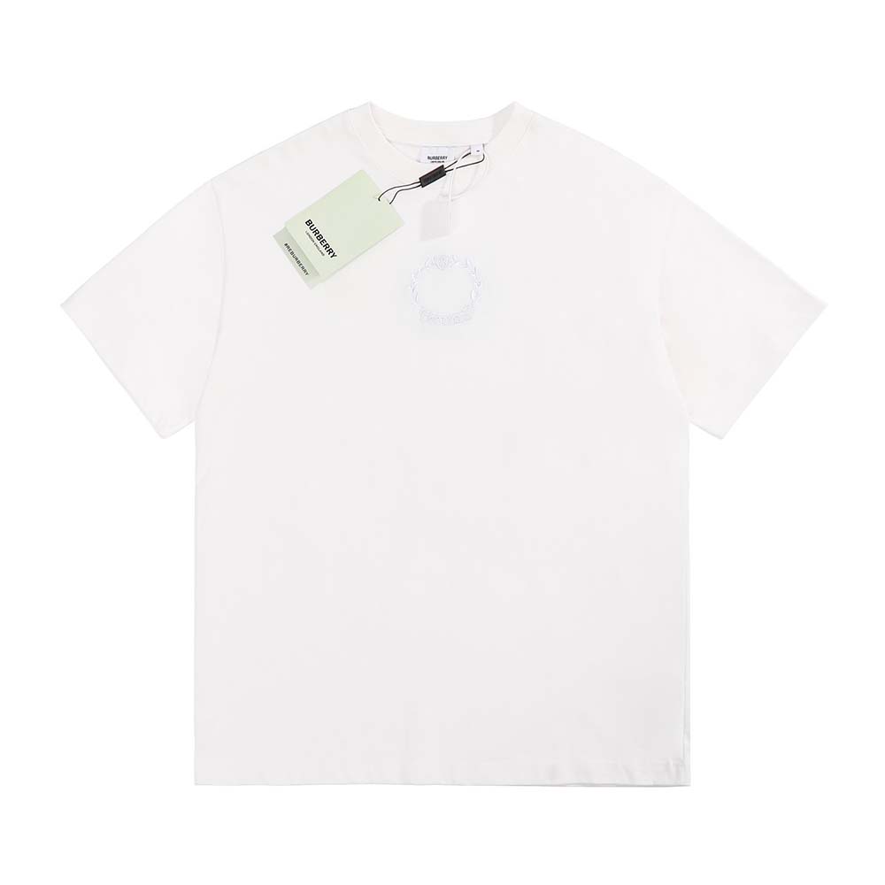 Close-up of embroidered oak leaf crest on white Burberry T-shirt
